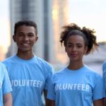 Teen Summer Library Program Volunteers wearing blue volunteer shirts.