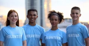 Teen Summer Library Program Volunteers wearing blue volunteer shirts.